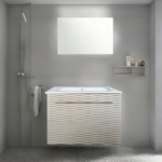 Mobiletto sospeso, specchio con luce led senza cornice in un bagno piccolo moderno